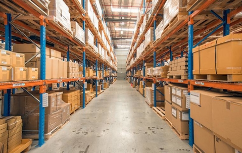 Large warehouse facility with hundreds of boxes on several shelves.